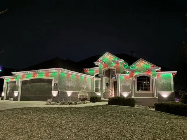 A different home with permanent roofline lighting in Christmas colors, from Get Lit’s project gallery