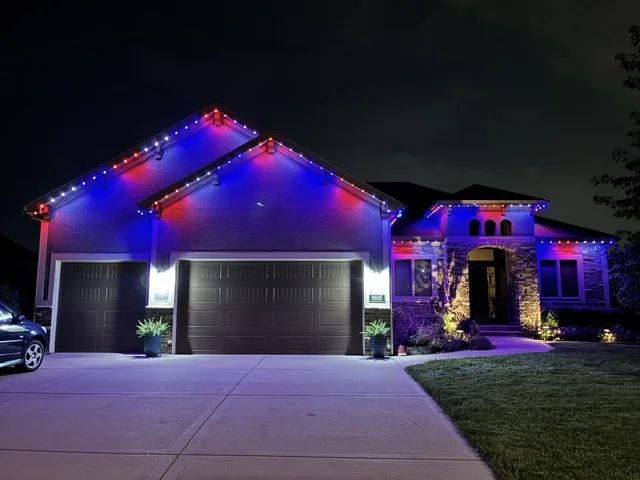 The same home with its permanent roofline lighting in red, white and blue